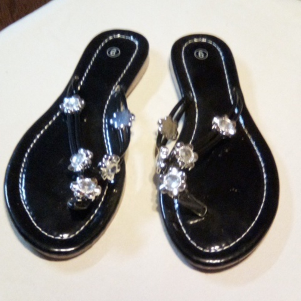 Beautiful black sandals with shiny flowers
